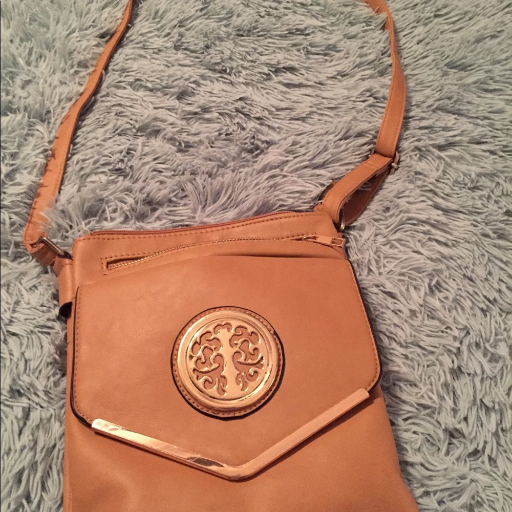 Light brown/dark tan purse.